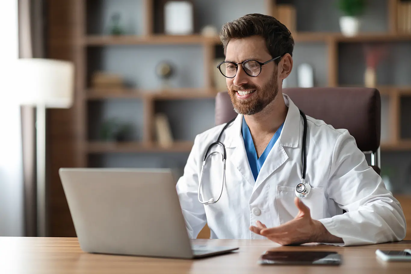 Leerink Partners Digital Health | Male doctor providing remote healthcare through a laptop