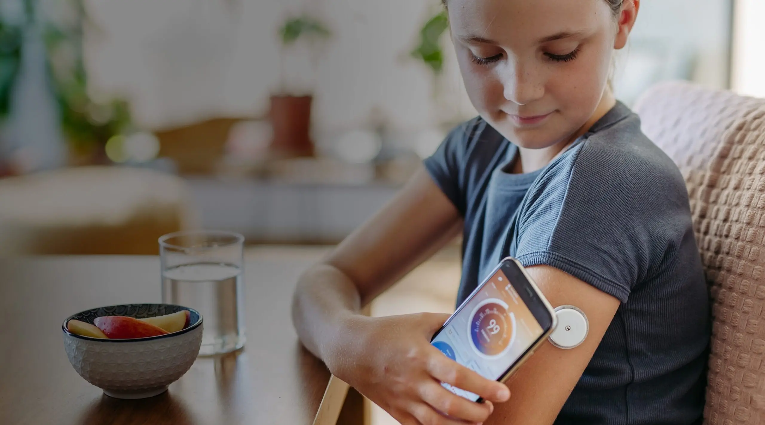 Leerink Partners Tools & Diagnostics Hero Image - Young girl checking her blood sugar with a mobile phone